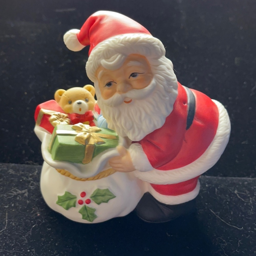 4” high and 4” wide Ceramic Santa with Bag of toys